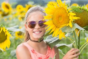 Child at Summer Sunflowers field