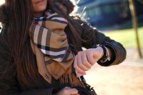 woman in wristwatch in blurred background