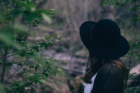 girl in hat at forest