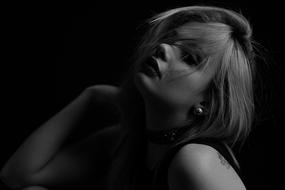 sensual girl at a photo shoot in the dark