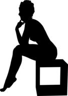 black silhouette of a girl sitting on a cube