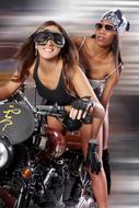 beautiful caucasian and african Girls riding motorbike