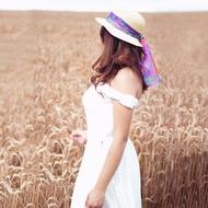 girl in white on a wheat field