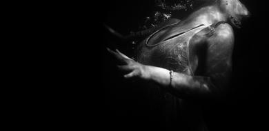 girl underwater in black and white background