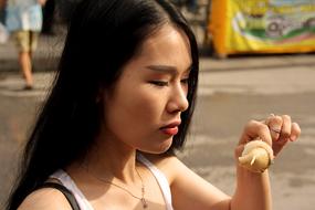 asian Woman eat at Summer