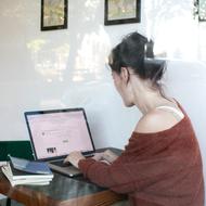 girl working at laptop in the office