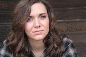 beautiful brunette on a wooden background