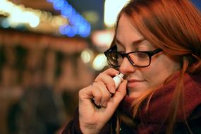 a girl with a runny nose