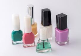 multicolored nail polishes in glass bottles