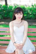 Portrait of Girl sitting on beach at park