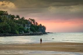 girl on the beach of a tropical island during sunset