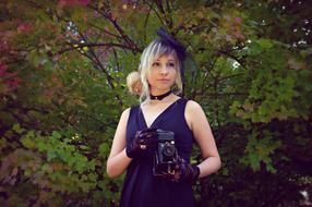 woman in retro style at a photo shoot in the park