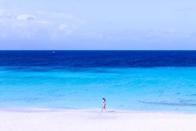 woman on blue ocean beach
