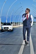 young businessman walking on the road