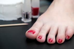 female leg with painted nails