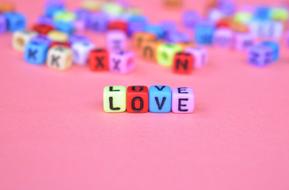 word love on cubes on a developed background