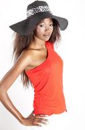 african american woman posing in wide hat