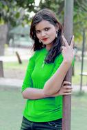 Smiling, Indian girl with make-up and earrings, outdoors