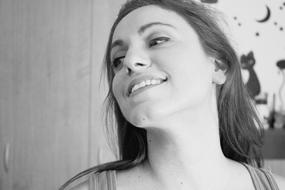 black and white portrait of a happy girl with long hair