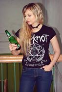 Blonde woman posing with the bottle