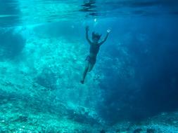 woman swims in ocean water