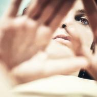 hands and face of a girl, close-up