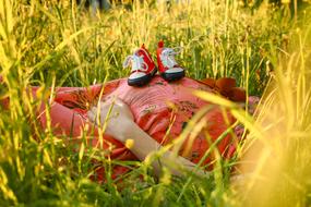 baby red shoes on pregnant belly