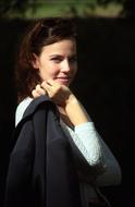 cheerful young woman outdoor, blur background
