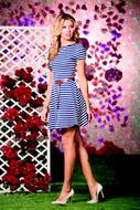 girl posing in a striped dress