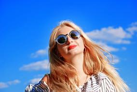 happy blonde in sunglasses