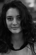 black white portrait of a girl with curly hair