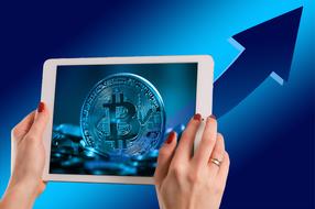 Woman with shiny wedding ring, holding white tablet with "Bitcoin" sign, at background with arrow growing up, clipart