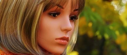 blonde mannequin on blurred background