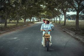 woman on a moped in asia