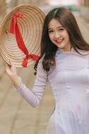 beautiful vietnamese girl on city street in blurred background