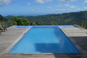 view of the pool against the backdrop of a picturesque landscape