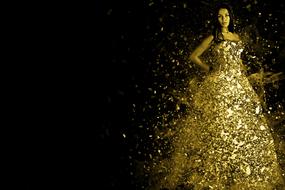 Woman in the beautiful, shiny, gold dress, with the shapes, at black background, clipart