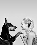 Black and White photo of Doberman with Blonde Woman