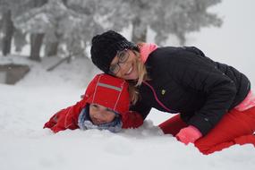 mother and child in the snow in winter