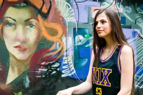 young sportswoman on graffiti background