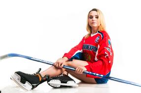 girl in a suit hockey player with a stick