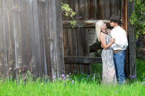 couple in love posing near the old barn