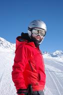 skier in a red jacket on the ski run