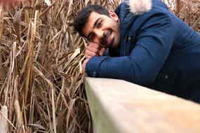 Man and dry grass