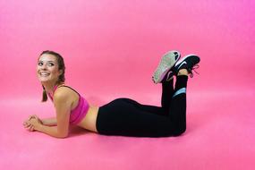 fitness girl on pink background