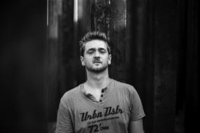 young man in a t-shirt with inscriptions