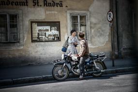 Man and Woman with bike on road