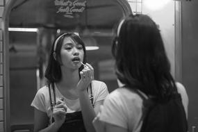 Girl looking at mirror