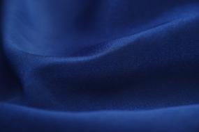 Close-up of the blue fabric textile with folds