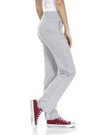 girl in trousers and red sneakers